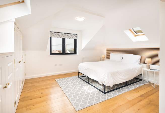 Spacious Bedroom 5 on the first floor with en suite cloakroom and wonderful ocean views. The family bathroom is just at the foot of the stairs. 