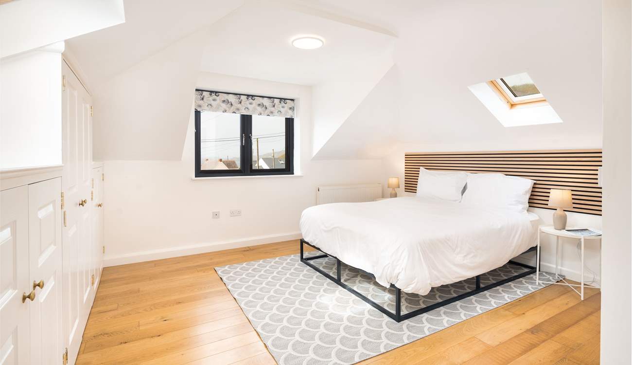 Spacious Bedroom 5 on the first floor with en suite cloakroom and wonderful ocean views. The family bathroom is just at the foot of the stairs. 