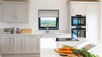 Who wouldn't want to be the holiday chef in this well-equipped, stylish kitchen with gorgeous sea and countryside views. 