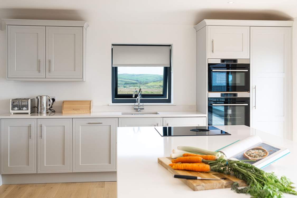 Who wouldn't want to be the holiday chef in this well-equipped, stylish kitchen with gorgeous sea and countryside views.