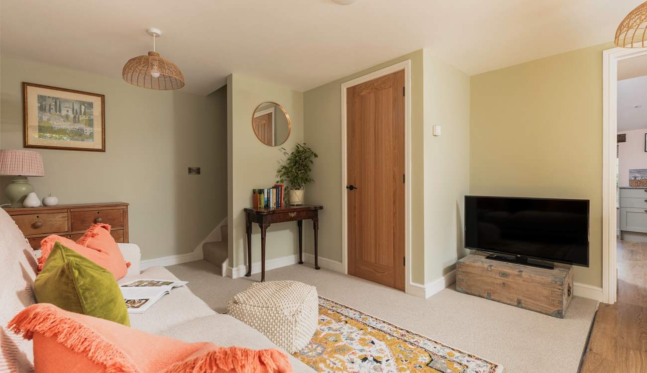 The cosiest of sitting-rooms awaits your arrival.