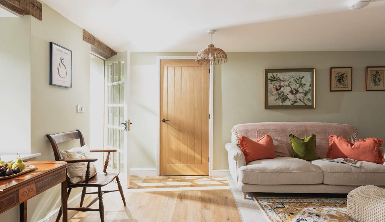 Muted tones complement the carefully selected furniture creating a lovely welcoming feeling. 