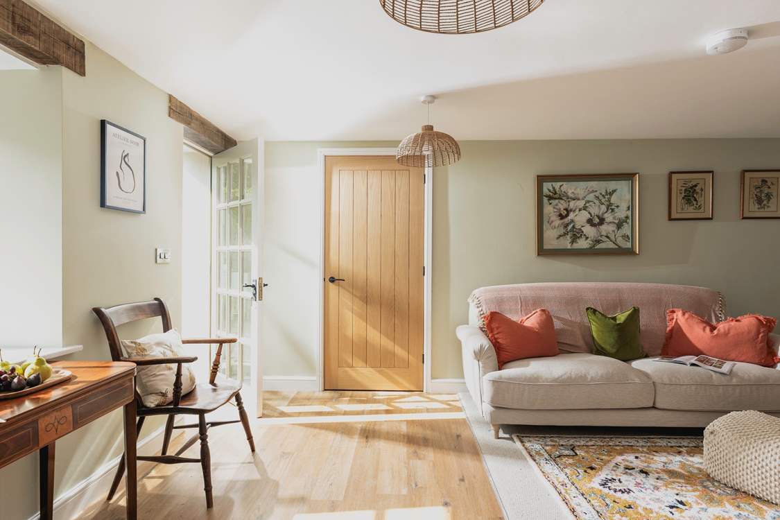 Muted tones complement the carefully selected furniture creating a lovely welcoming feeling.