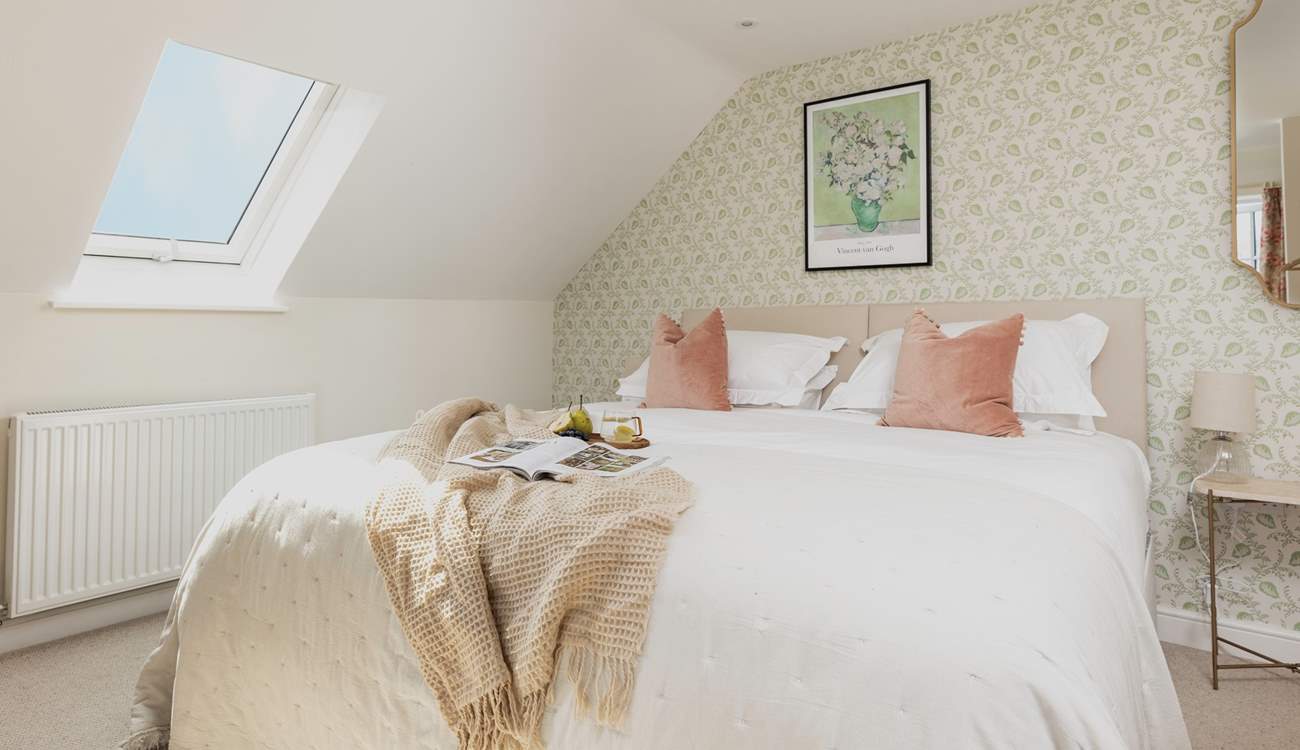 The tranquil bedroom offers the perfect spot to recharge. This bed can also be made up as a twin for flexibility.