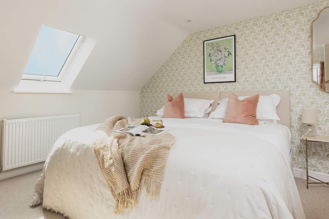 The tranquil bedroom offers the perfect spot to recharge. This bed can also be made up as a twin for flexibility.