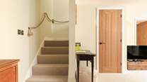 Head upstairs to the bedroom.