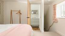 Head through to the en suite bathroom or downstairs.