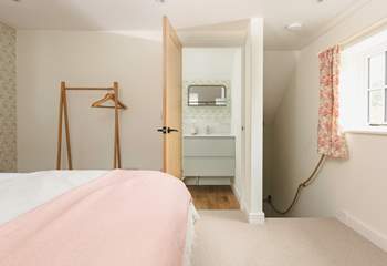 Head through to the en suite bathroom or downstairs.