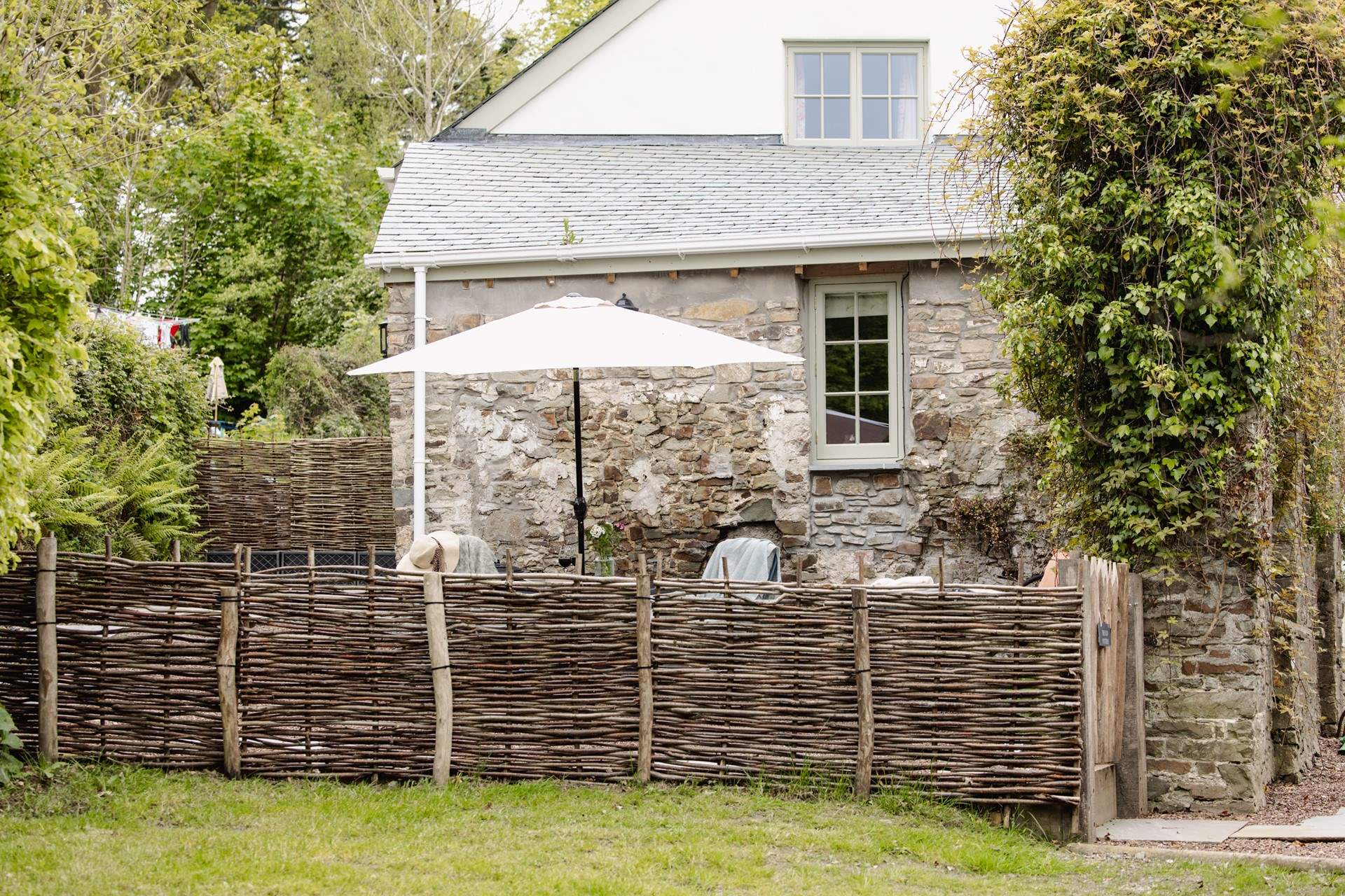The garden is fully enclosed with a table and chairs - not forgetting the swing chair!
