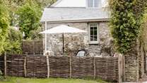 The garden is fully enclosed with a table and chairs - not forgetting the swing chair!