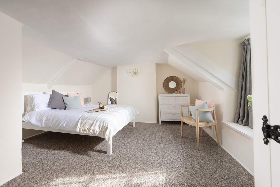 Bedroom two is up on the second floor - set under the eaves, the room is full of character.