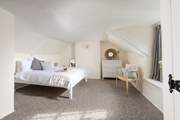 Bedroom two is up on the second floor - set under the eaves, the room is full of character.