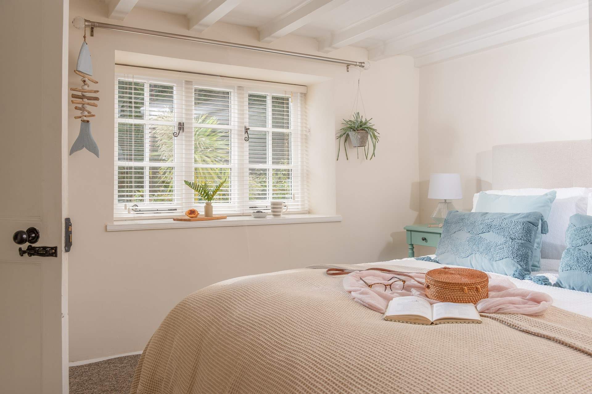 A comfy king-size bed awaits in bedroom one.