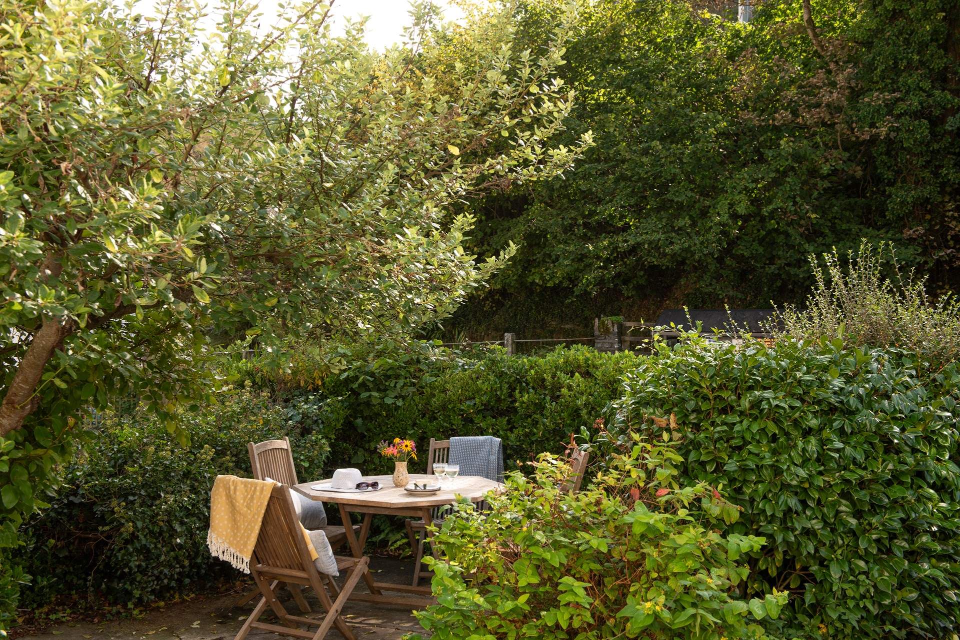 Soak up the sunshine on the pretty terrace at the front of the cottage.