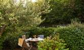 Soak up the sunshine on the pretty terrace at the front of the cottage. - Thumbnail Image