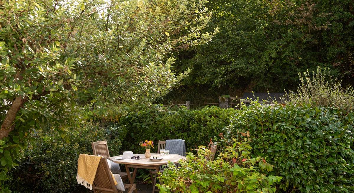 Soak up the sunshine on the pretty terrace at the front of the cottage.