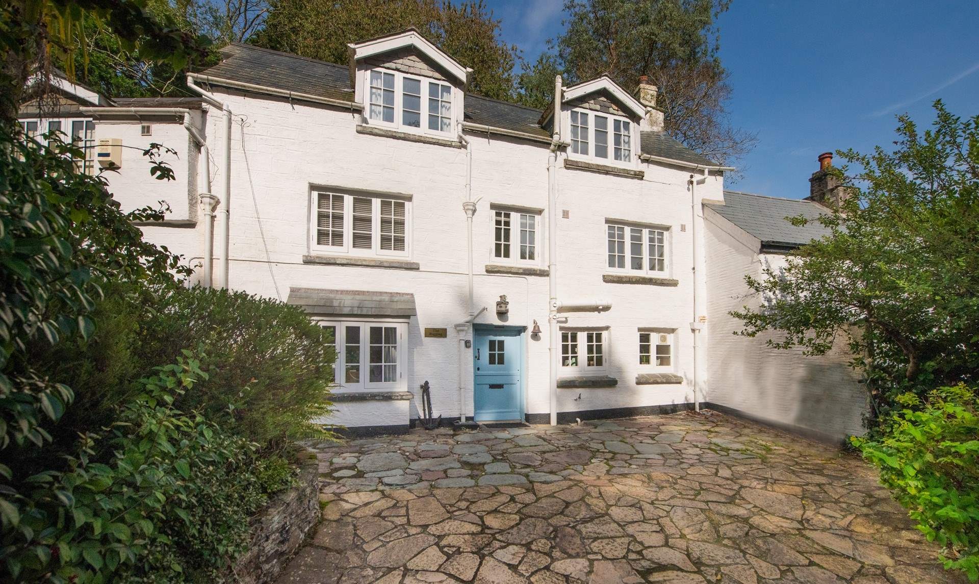 This charming three-storey cottage has private parking at the front - a real bonus in Polperro.