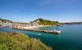 Grab some fish and chips in the town of Looe, best enjoyed sitting on the Banjo Pier that juts out into the sparkling sea. - Thumbnail Image