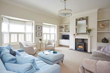 Take a seat in the beautifully arranged sitting-room with cosy wood-burner, lovely neutral colour palette and comfortable sofas, super tranquil appeal for guests.