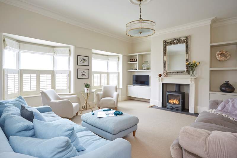 Take a seat in the beautifully arranged sitting-room with cosy wood-burner, lovely neutral colour palette and comfortable sofas, super tranquil appeal for guests.