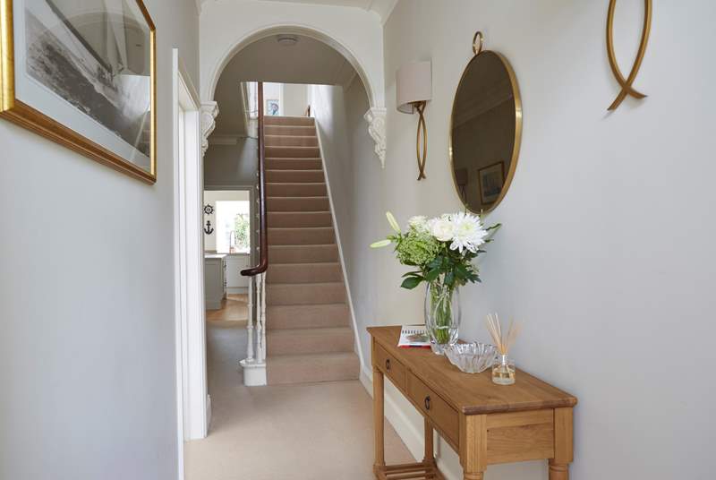 A warm welcoming hallway in Alton House with beautiful original features throughout.