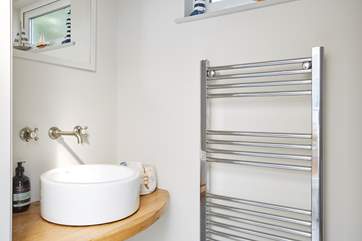 The cloakroom off the hallway with contemporary wash-basin.