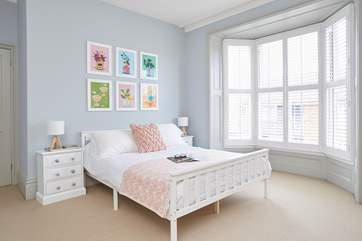 The super stylish main bedroom with a king-size bed faces the front of the house and has the most restful vibe.