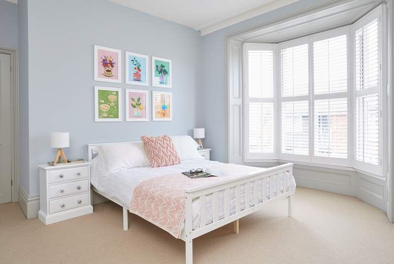 The super stylish main bedroom with a king-size bed faces the front of the house and has the most restful vibe.