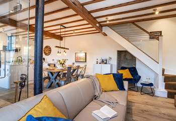 The open plan living is perfect for get togethers, look at the amazing beams and original column, a nod to the history of Beckstones House. 
