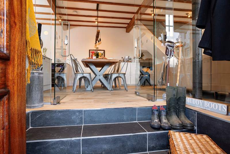 Muddy boots and picnic baskets have a perfect place in the glass entrance hall. 