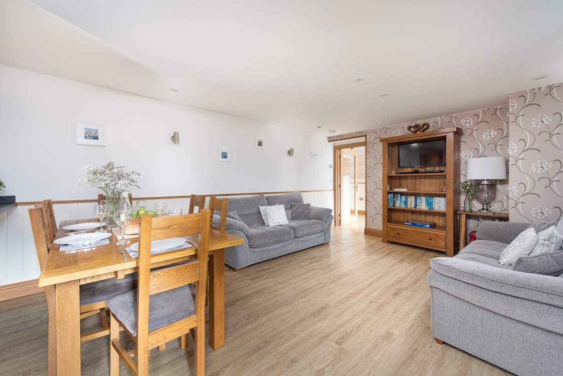 Cosy up with a good film together in the sizable living space