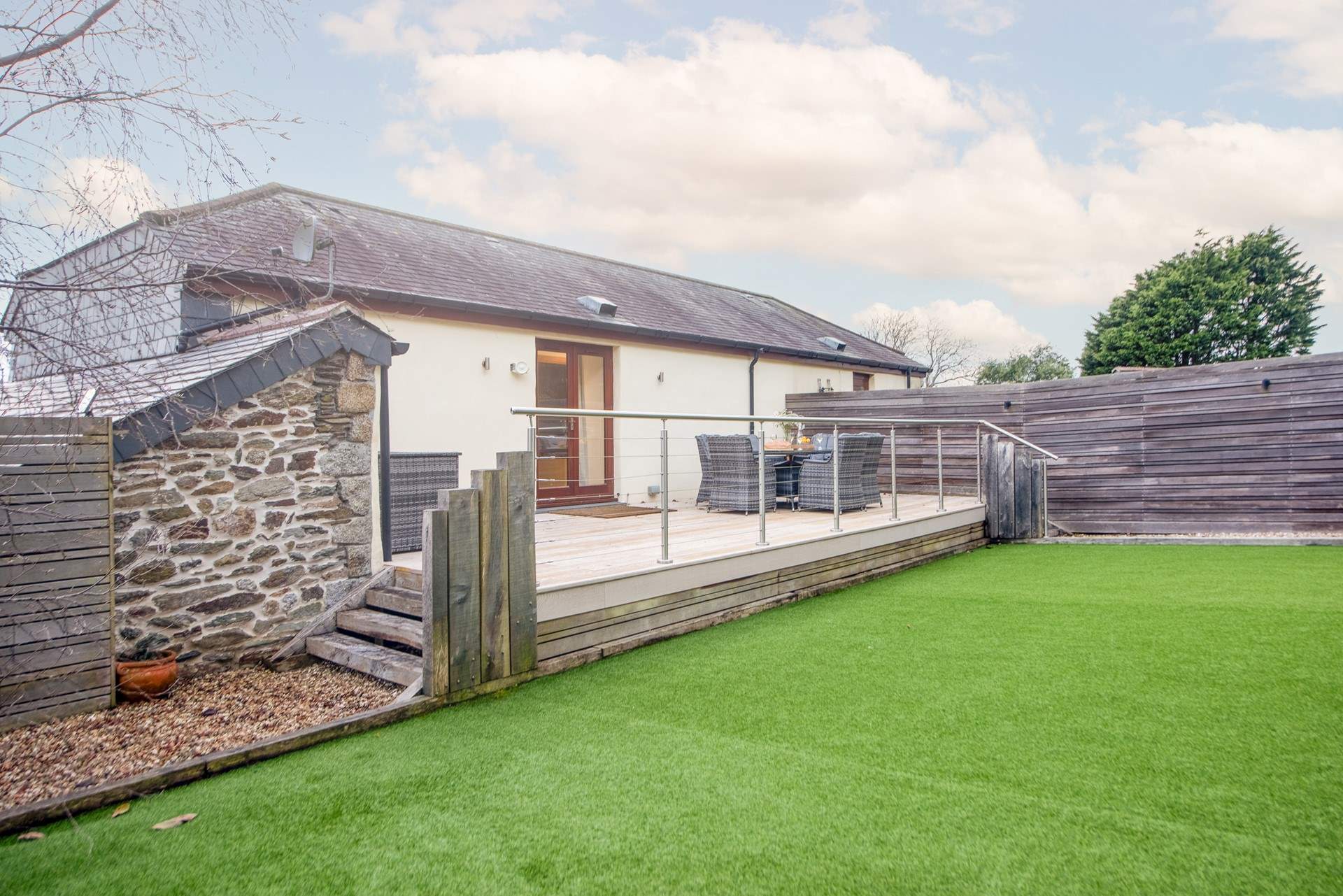 A large and safe space in the secure, enclosed garden, with no worries about muddy paws from the astroturf.