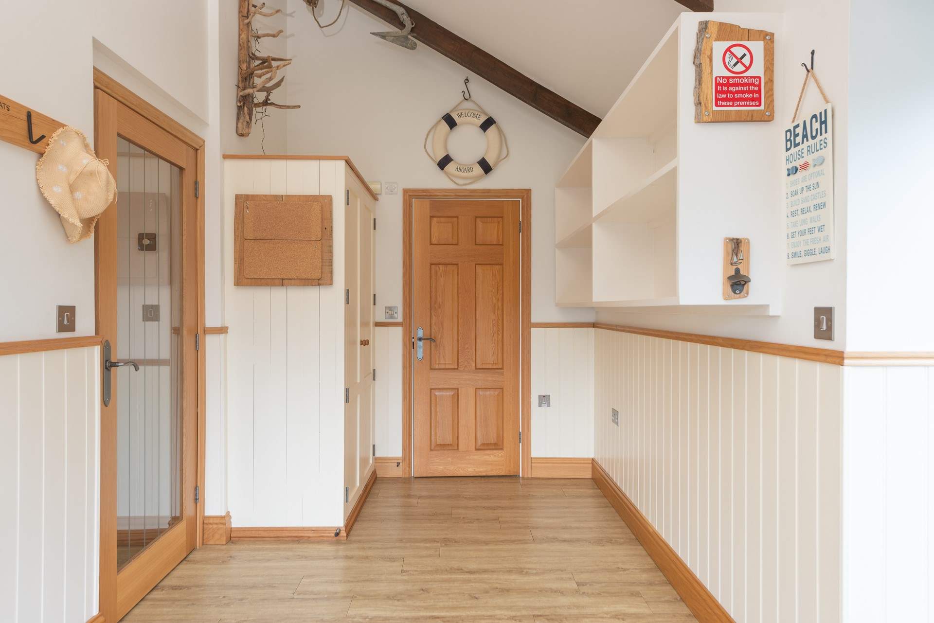 A welcoming and spacious entrance vestibule. There is a handy shower-room here.