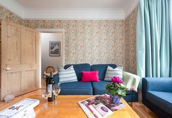 Exposed pine floors and comfy sofas invite you to relax and unwind and in cooler months the wood-burner will keep you warm and toasty. 