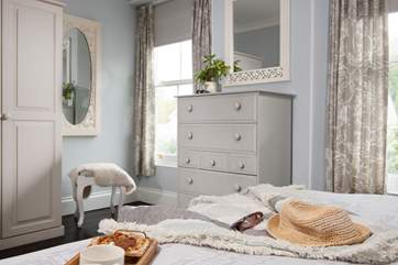 Bedroom one is decorated in soft greys.