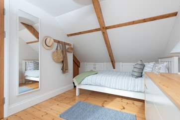 The beds are located beneath the eaves, so please take care.