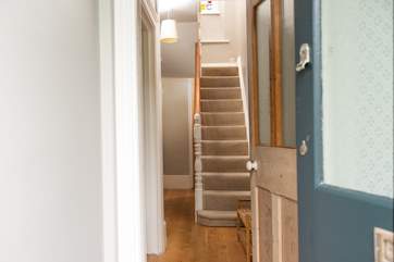 The welcoming hallway, with stairs leading up to the first floor.