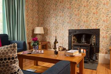 On winter days the sitting-room, complete with the original wood-burner, will be the heart of the home.