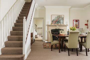 Art lovers will enjoy the quirky pictures adorning the dining-room walls.