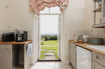 The kitchen opens out to the beautiful front lawn.