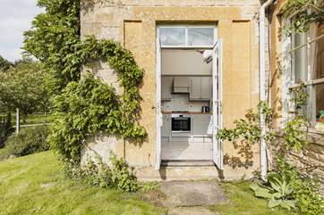 The pretty Cotswold wing with climbing wisteria is picture perfect.