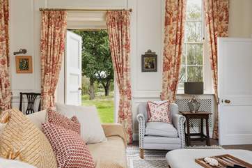 During warmer months the panelled door opens out to gardens in front of the carp pond.