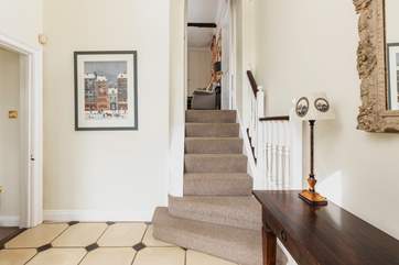 Steps lead from the entrance hall to the sitting-room.