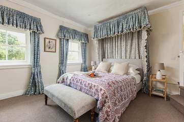 Treat yourself to the finer things in life with this fabulous canopied bed.
