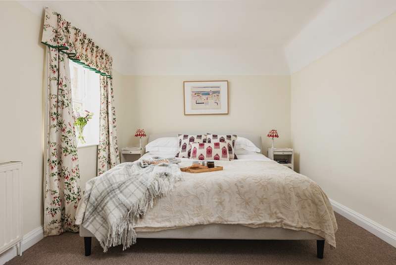 A bright and comfortable bedroom to enjoy breakfast in bed and catch up on some news.