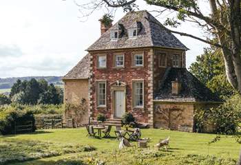 The original red brick side of The Summer House was built in 1720 as a banqueting house at the head of the carp ponds.