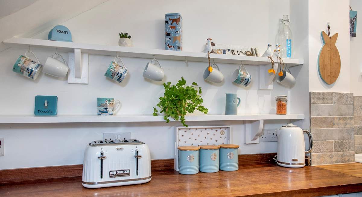 The touches continue upstairs. Please note that there is a sloping ceiling in the kitchen.