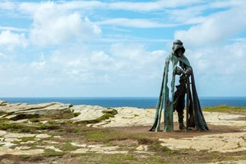 King Arthur's statue stands proudly on the cliff at Tintagel. 