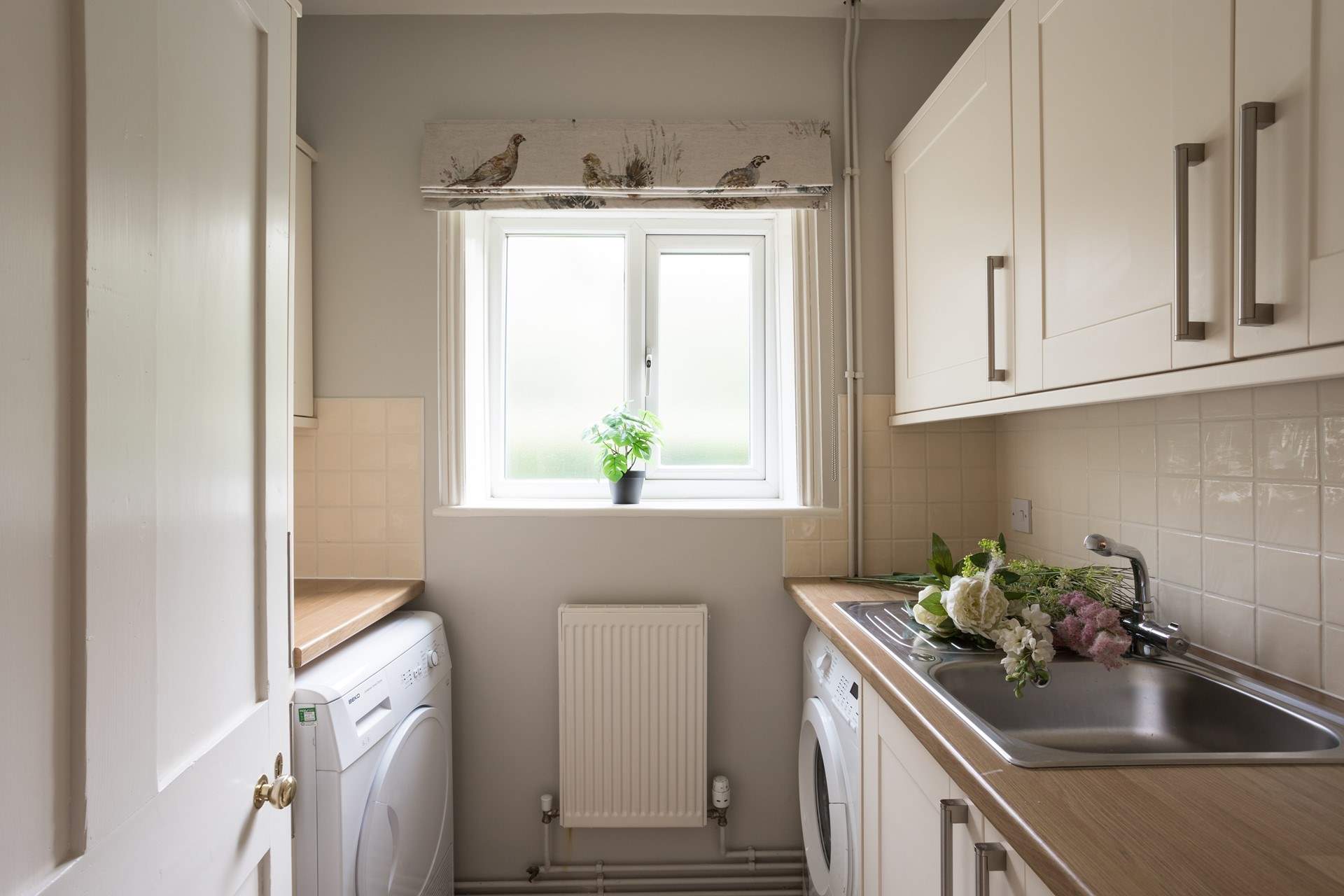 There is a handy utility-room next to the kitchen.