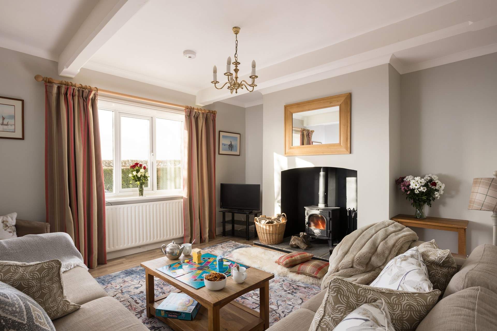 The characterful snug has a warm cosy feel (please note the wood-burner has been replaced by an electric fire).